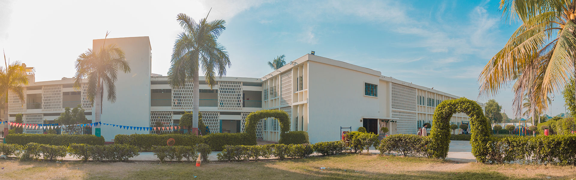 Aga Khan School, Garden campus buildings surrounded by palm trees and gardens